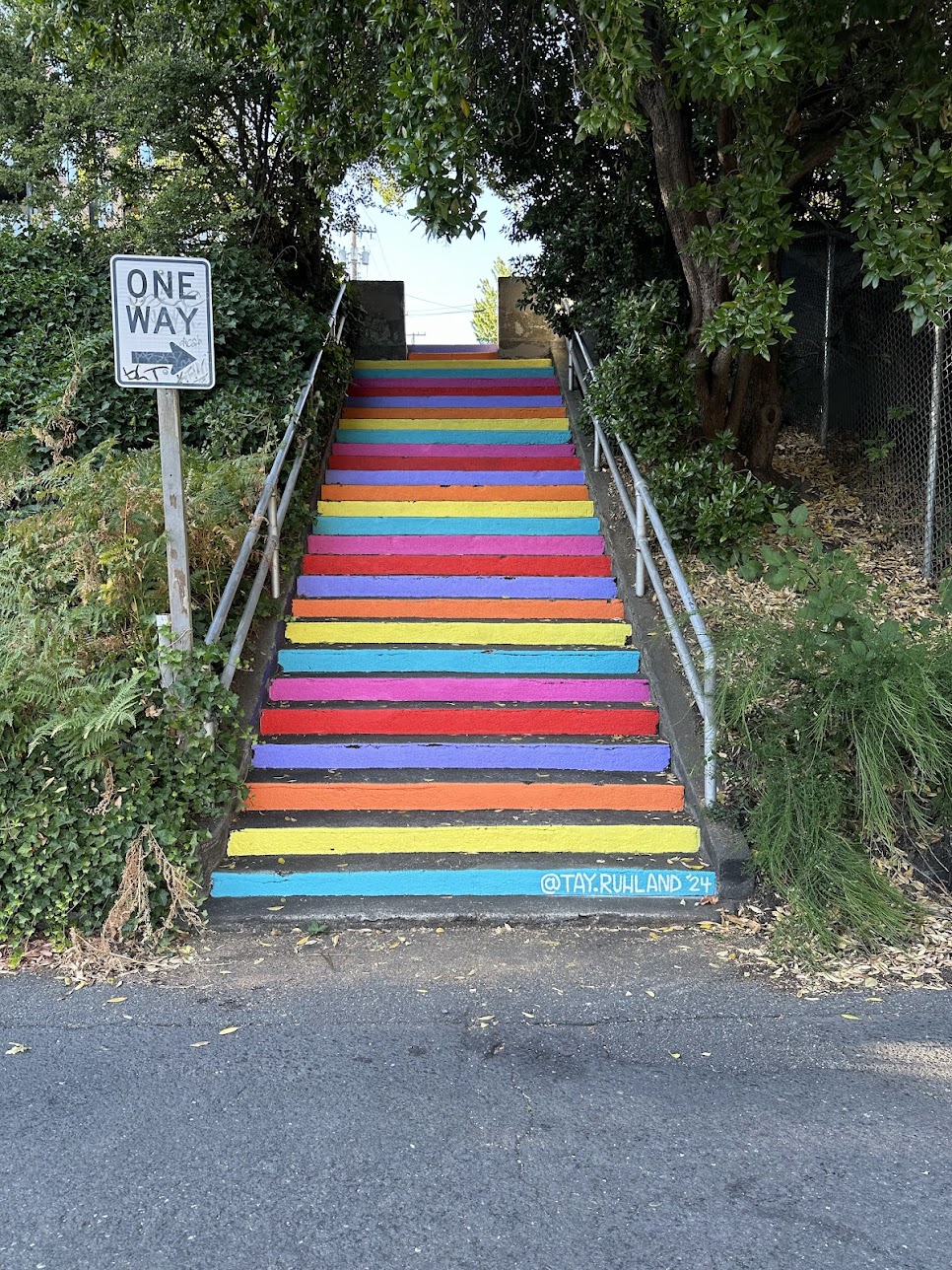 Rainbow Steps mural featuring vibrant multicolored painted steps in Seattle neighborhood