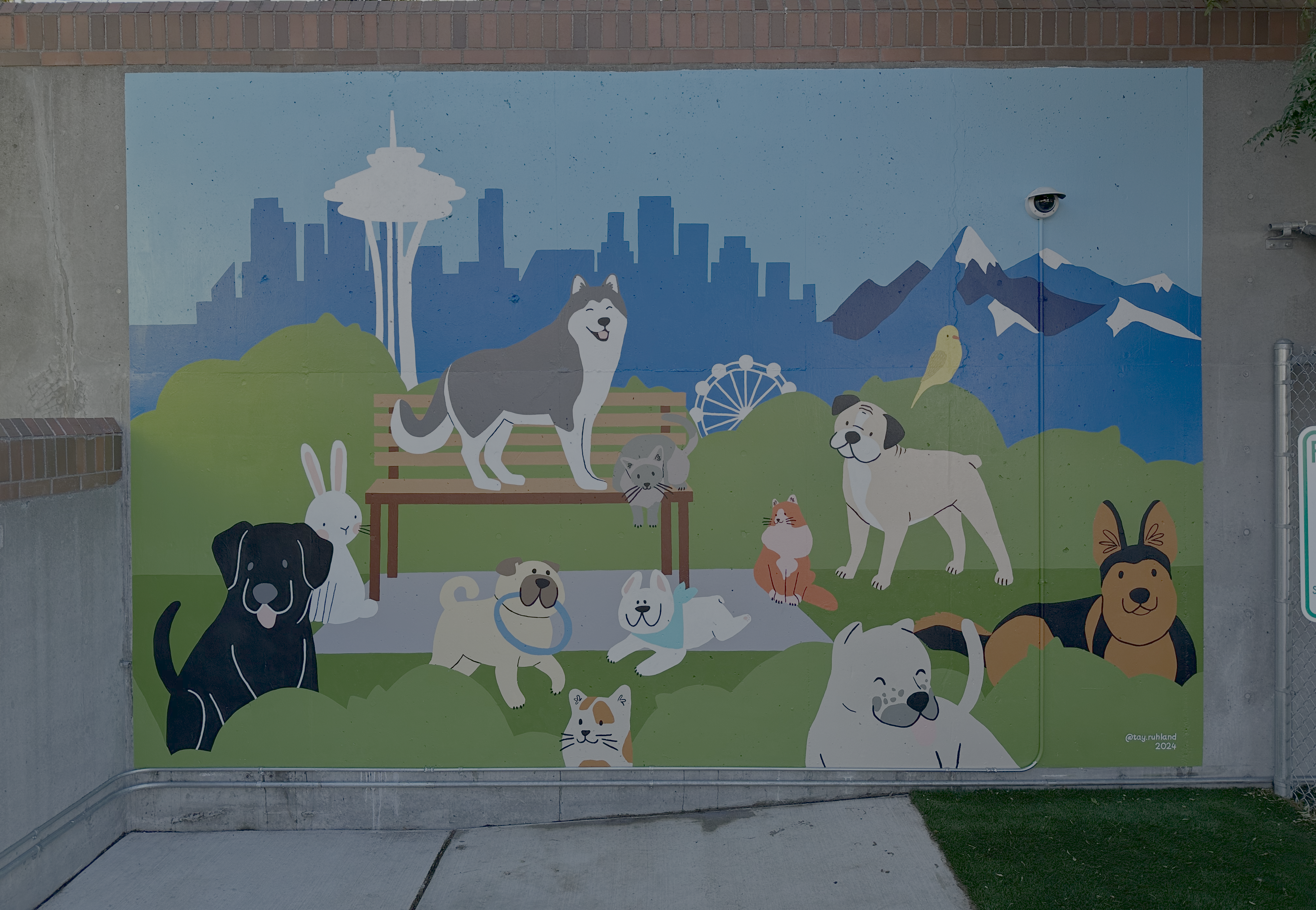 Pets at the Park mural at Seattle Animal Shelter featuring dogs and cats in a park setting
